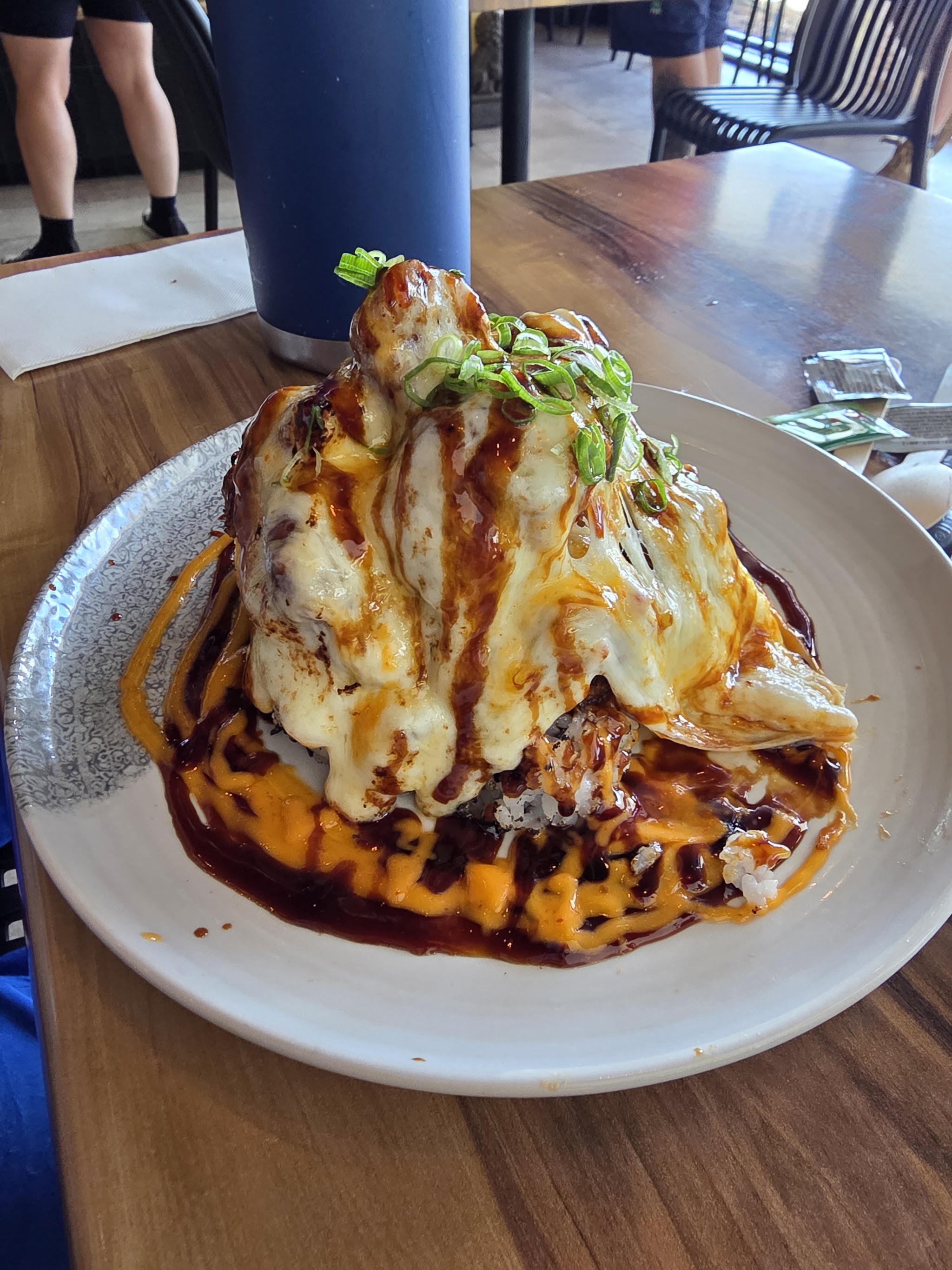 The karaage chicken volcano: crispy chicken piled high under melted cheese, spring onion and sauce